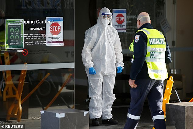 Medical staff and a health commander are seen at an aged care facility in Melbourne in July